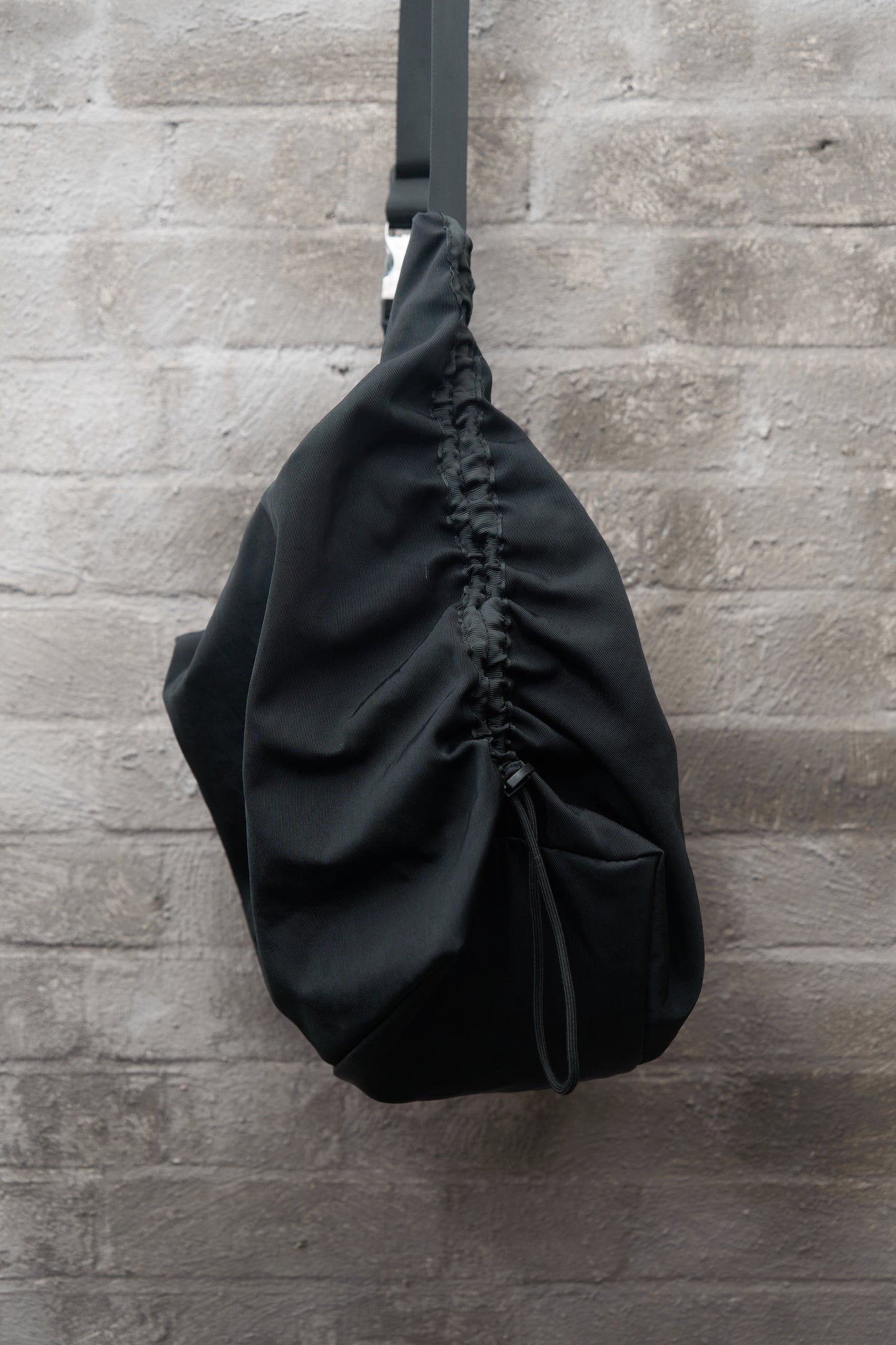 Drawstring crossbody bag